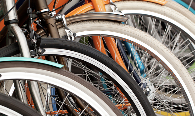 Row of colorful Bike wheels